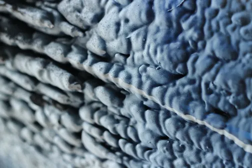 Close-up view of blue spray foam insulation
