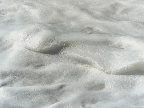 Close-up view of white spray foam insulation